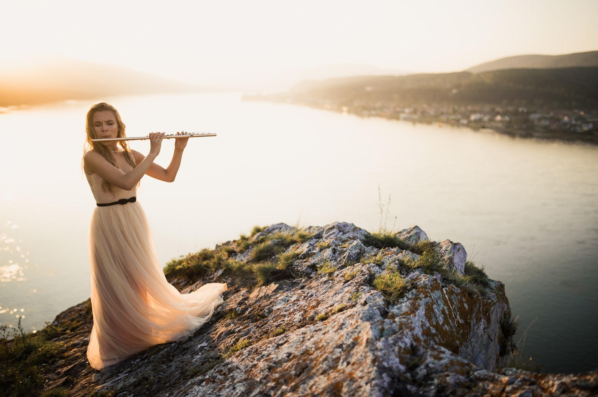 Taya playing the flute