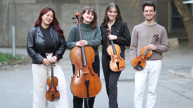 string quartet smiling for a photo