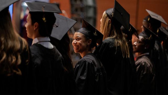 group of graduates watching a presentation 